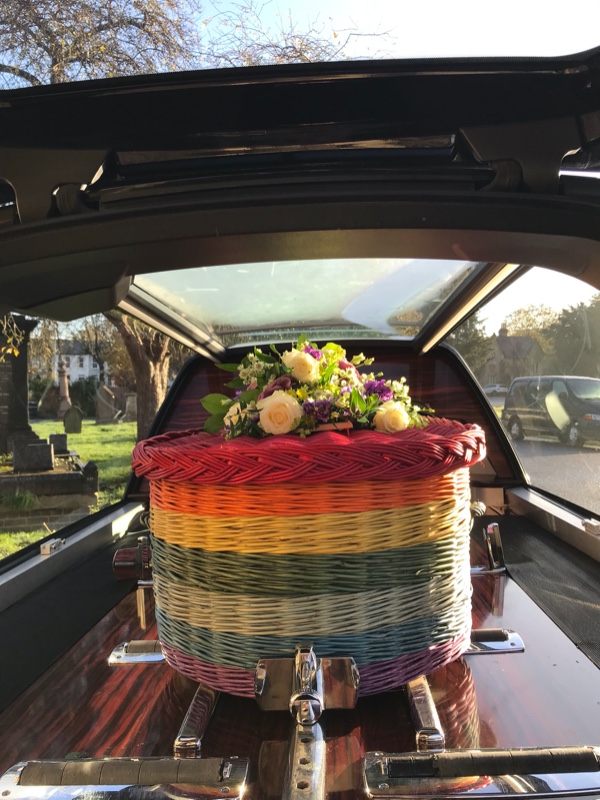 Rainbow-coffin-flowers-hearse